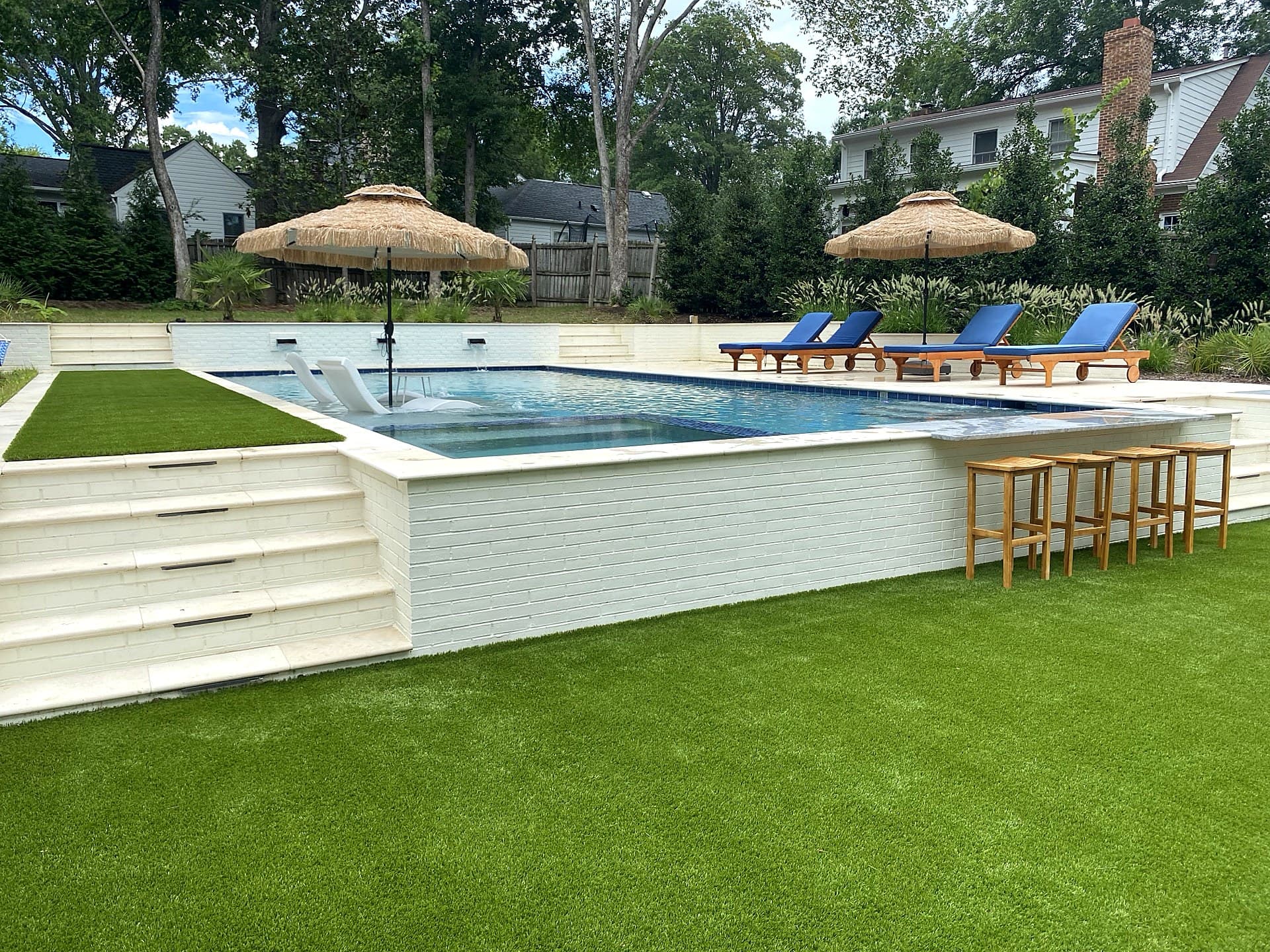 Backyard resort with swim-up bar